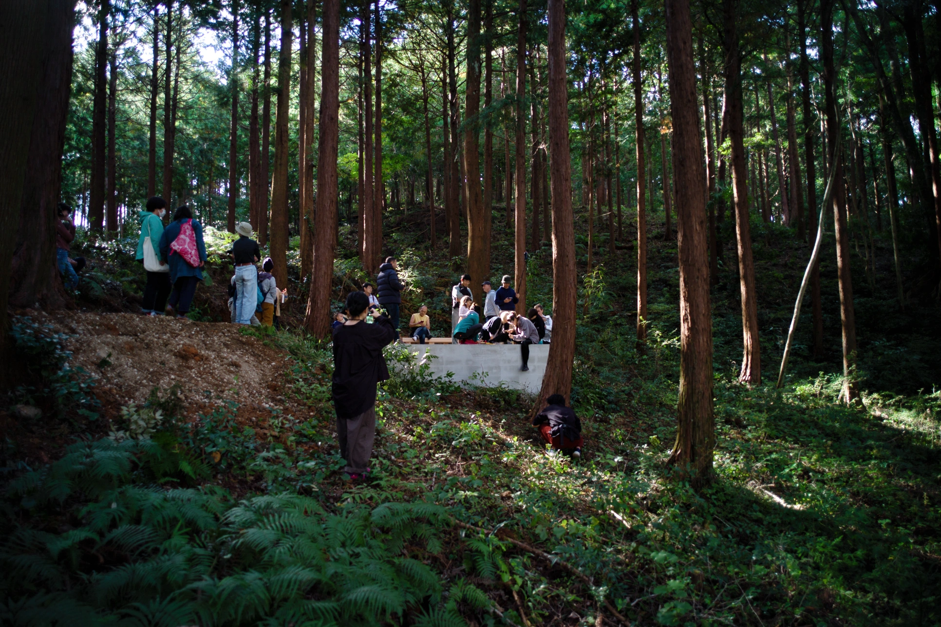 Visitors gathered around Liminality, a public artwork by Ewa Wes (Wesołowska), during its inauguration in Kamiyama, Japan.